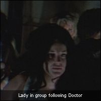 Lady in group following Doctor