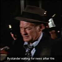 Bystander waiting for news after fire