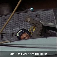 Man Firing Line from Helicopter