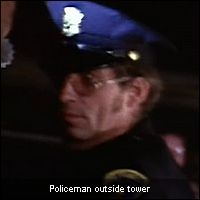 Policeman outside tower