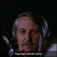 Reporter outside tower